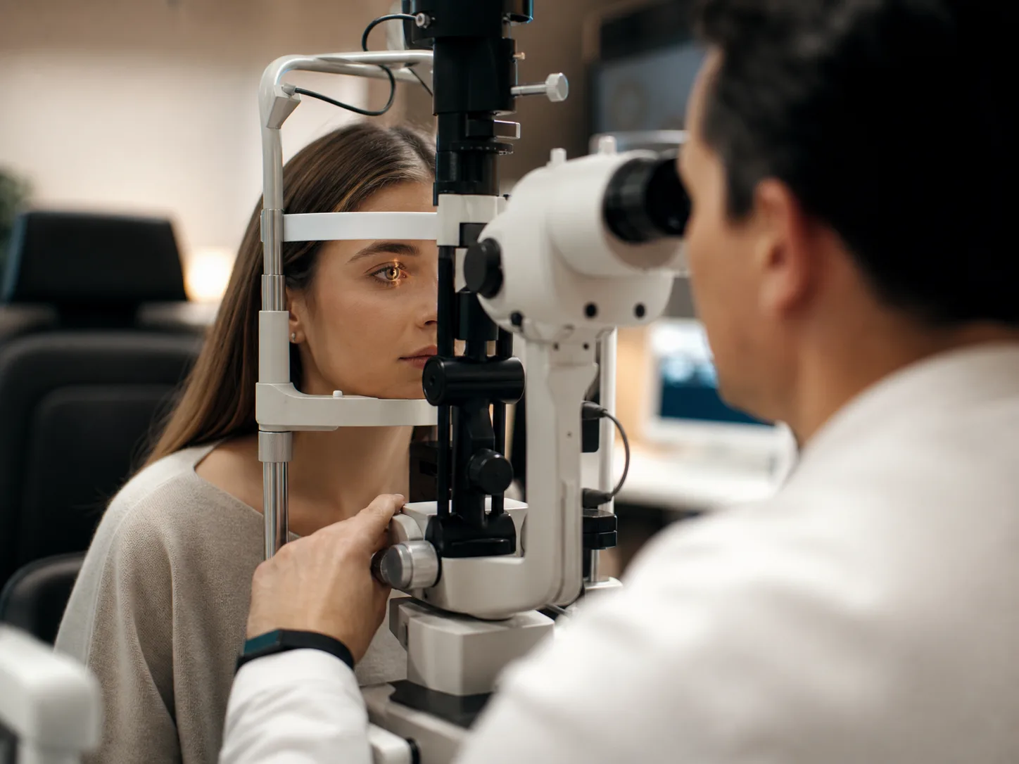 Optometrist performing an eye examination with specialist equipment